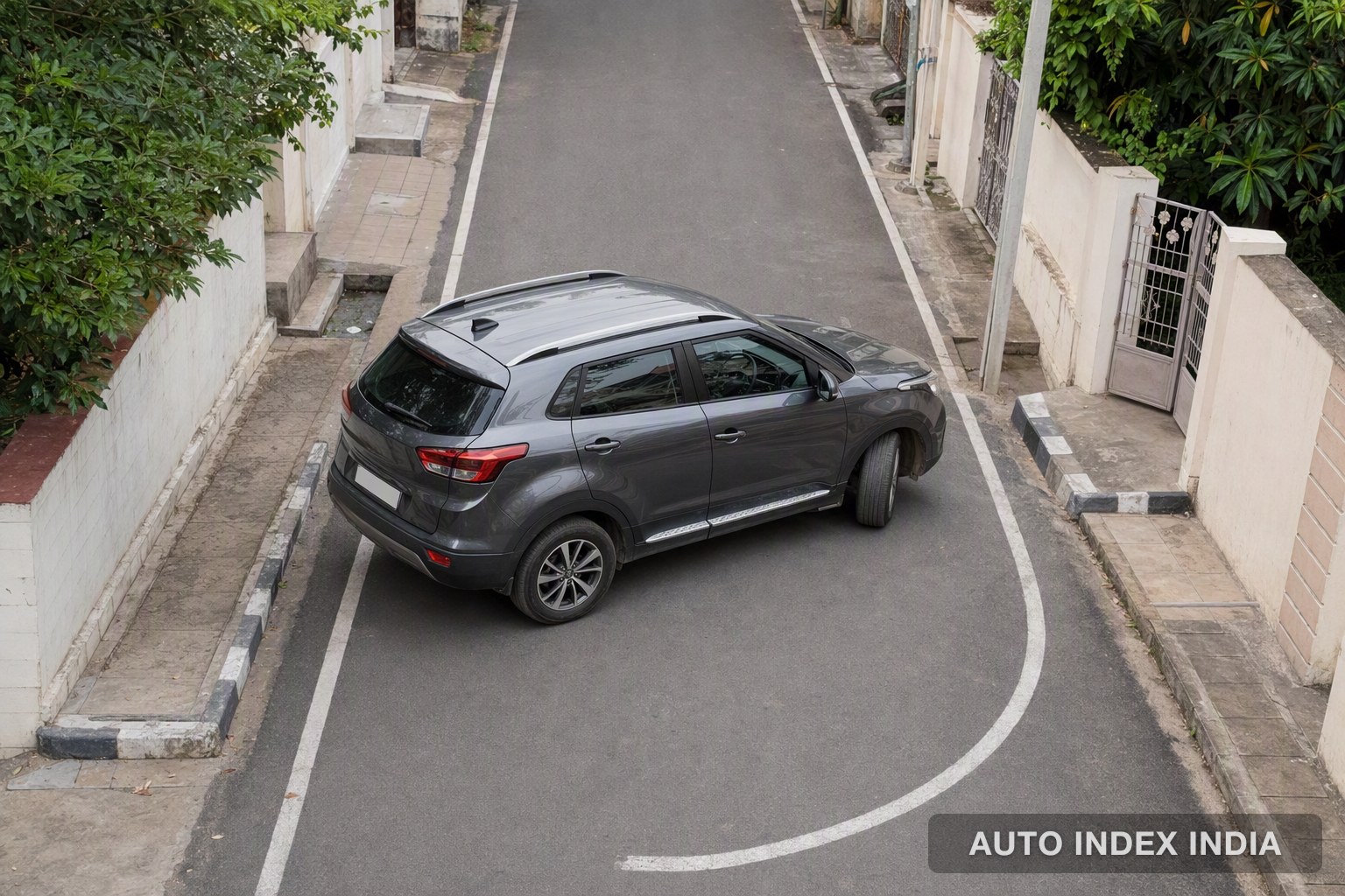 An SUV making a tight U-turn on a narrow street